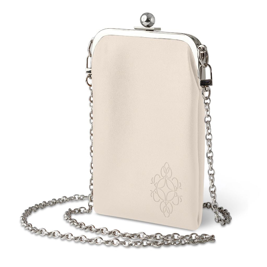 Cream eyeglass case and phone crossbody bag with a silver chain strap and decorative clasp detail.
